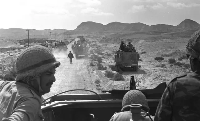 FILE - In this photo released by the Government Press Office, Israeli troops advance towards Egyptian position in the southern Sinai during the Six Day War, June 1967. (AP Photo/Government Press Office, File)