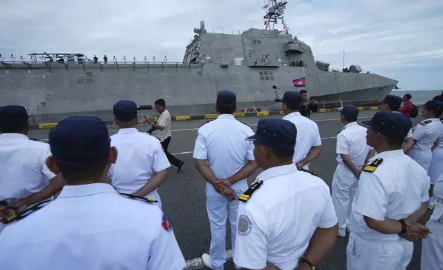 Cambodian naval troop stand for welcoming USS Savannah as it arrives for a port call at Sihanoukville port, Cambodia, Monday, Dec. 16, 2024. (AP Photo/Heng Sinith)