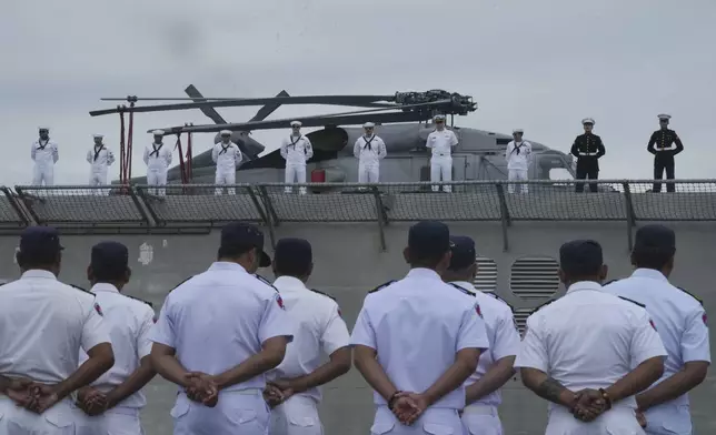 Cambodian naval troop stand for welcoming USS Savannah as it arrives for a port call at Sihanoukville port, Cambodia, Monday, Dec. 16, 2024. (AP Photo/Heng Sinith)