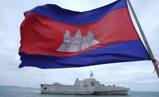 A Cambodian flag flutters as USS Savannah arrives for a port call at Sihanoukville port, Cambodia, Monday, Dec. 16, 2024. (AP Photo/Heng Sinith)