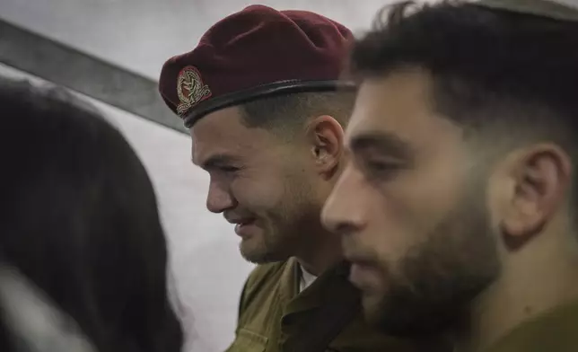 A soldier mourns during the funeral of combat engineer squad commander Staff Sgt. Zamir Burke, 20, from Beit Shemesh, during his funeral at Mount Herzl military cemetery in Jerusalem, Israel, Sunday Nov. 1, 2024. Burke was killed in combat with Hamas at the Jabaliya refugee camp in Gaza. (APcPhoto/Mahmoud Illean)