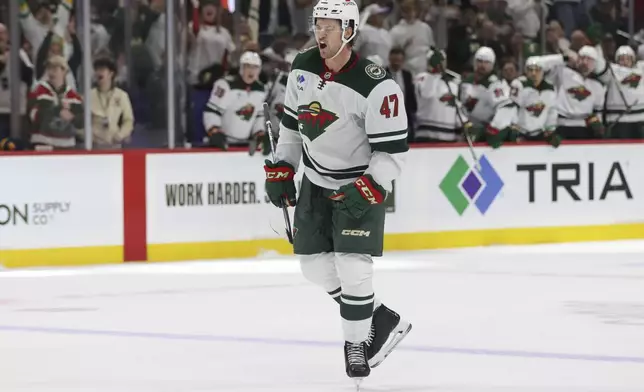 Minnesota Wild defenseman Declan Chisholm (47) celebrates after scoring during the first period of an NHL hockey game against the Nashville Predators, Saturday, Nov. 30, 2024, in St. Paul, Minn. (AP Photo/Bailey Hillesheim)