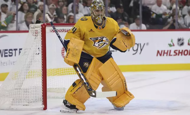 Nashville Predators goaltender Juuse Saros watches the action during the first period of an NHL hockey game against the Minnesota Wild, Saturday, Nov. 30, 2024, in St. Paul, Minn. (AP Photo/Bailey Hillesheim)