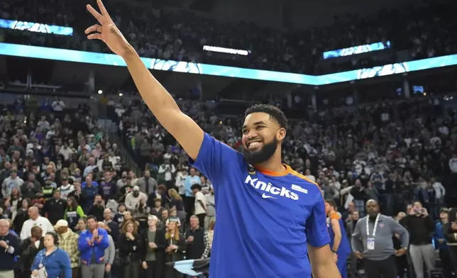 New York Knicks center Karl-Anthony Towns acknowledges the crowd before an NBA basketball game against the Minnesota Timberwolves, Thursday, Dec. 19, 2024, in Minneapolis. (AP Photo/Abbie Parr)