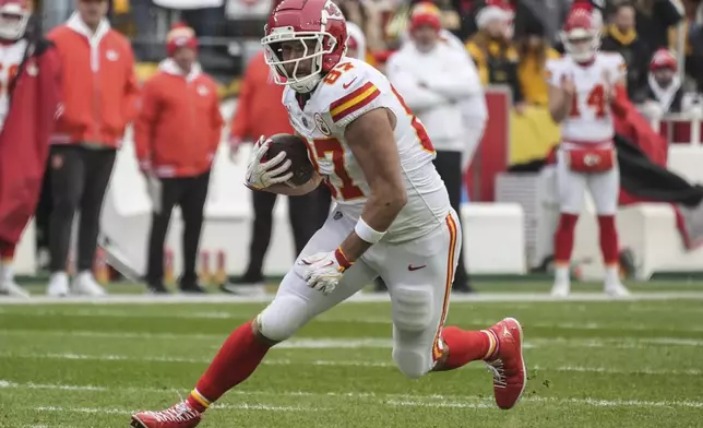 Kansas City Chiefs tight end Travis Kelce (87) runs against the Pittsburgh Steelers during the first half of an NFL football game, Wednesday, Dec. 25, 2024, in Pittsburgh. (AP Photo/Gene J. Puskar)