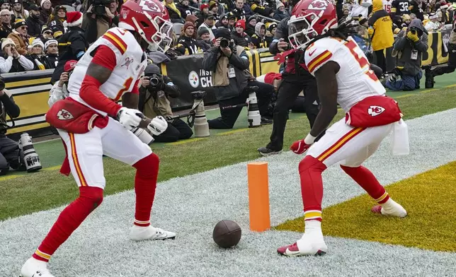 Kansas City Chiefs wide receiver Xavier Worthy (1) celebrates his touchdown with Hollywood Brown (5) during the first half of an NFL football game against the Pittsburgh Steelers, Wednesday, Dec. 25, 2024, in Pittsburgh. (AP Photo/Matt Freed)