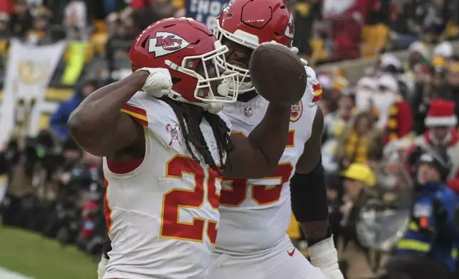 Kansas City Chiefs running back Kareem Hunt (29) celebrates his touchdown against the Pittsburgh Steelers during the second half of an NFL football game, Wednesday, Dec. 25, 2024, in Pittsburgh. (AP Photo/Gene J. Puskar)