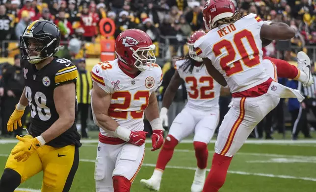 Kansas City Chiefs safety Justin Reid (20) intercepts the ball intended for Pittsburgh Steelers tight end Pat Freiermuth (88) during the first half of an NFL football game, Wednesday, Dec. 25, 2024, in Pittsburgh. (AP Photo/Gene J. Puskar)