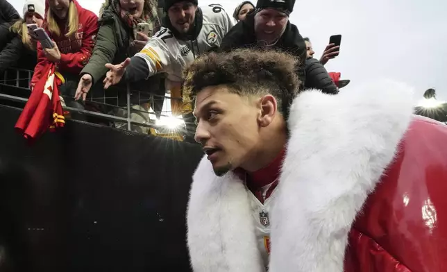 Fans cheer for Kansas City Chiefs quarterback Patrick Mahomes after an NFL football game against the Pittsburgh Steelers, Wednesday, Dec. 25, 2024, in Pittsburgh. (AP Photo/Gene J. Puskar)