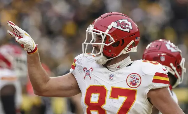 Kansas City Chiefs tight end Travis Kelce (87) celebrates his touchdown against the Pittsburgh Steelers during the second half of an NFL football game, Wednesday, Dec. 25, 2024, in Pittsburgh. (AP Photo/Matt Freed)