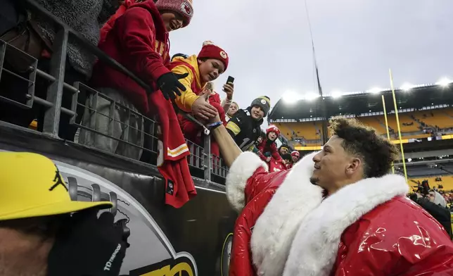 Fans cheer for Kansas City Chiefs quarterback Patrick Mahomes after an NFL football game against the Pittsburgh Steelers, Wednesday, Dec. 25, 2024, in Pittsburgh. (AP Photo/Matt Freed)