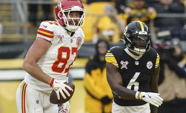 Kansas City Chiefs tight end Travis Kelce (87) celebrates his touchdown against the Pittsburgh Steelers during the second half of an NFL football game, Wednesday, Dec. 25, 2024, in Pittsburgh. (AP Photo/Matt Freed)