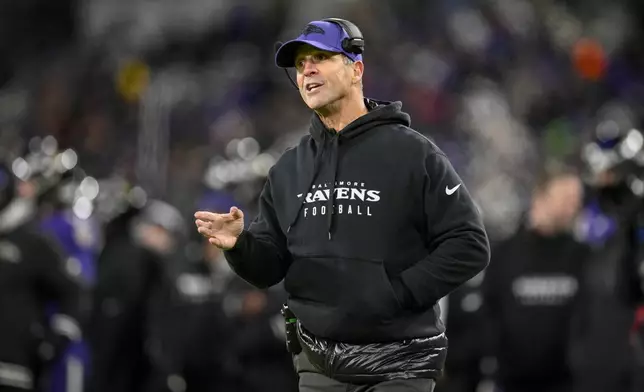 Baltimore Ravens head coach John Harbaugh talks to an official during the second half of an NFL football game against the Pittsburgh Steelers, Saturday, Dec. 21, 2024, in Baltimore. (AP Photo/Nick Wass)