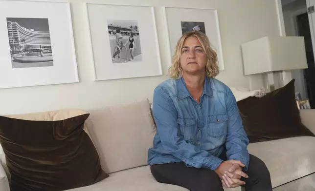 Kelli Roiter, a condo owner, pauses during an interview, Wednesday, Nov. 27, 2024, in Hallandale, Fla. Roiter said her building is showing some of the same problems that were visible in Champlain Towers South when it collapsed three years ago, which is just a few miles down the coast from her building. (AP Photo/Marta Lavandier)