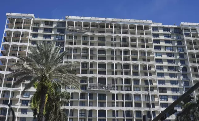 An older residential building is undergoing repairs to all of its balconies, Tuesday, Dec. 3, 2024, in Bal Harbor, Fla. (AP Photo/Marta Lavandier)