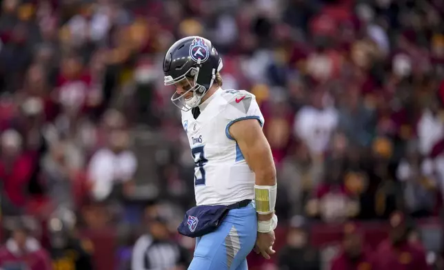 Tennessee Titans quarterback Will Levis (8) walks to the sideline during the first half of an NFL football game against the Washington Commanders, Sunday, Dec. 1, 2024, in Landover, Md. (AP Photo/Matt Slocum)