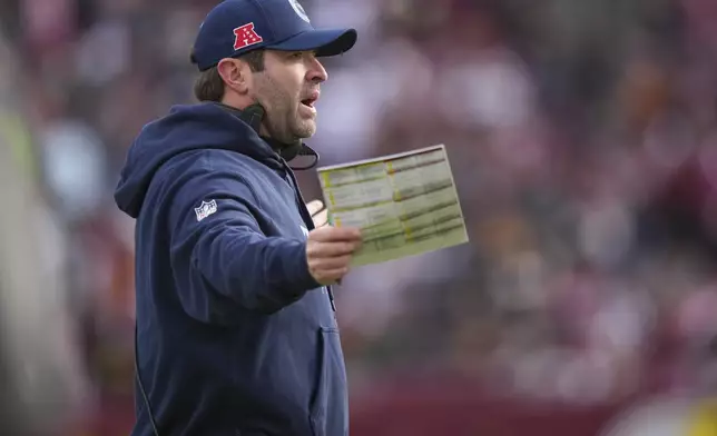 Tennessee Titans head coach Brian Callahan yells to an official during the first half of an NFL football game against the Washington Commanders, Sunday, Dec. 1, 2024, in Landover, Md. (AP Photo/Matt Slocum)