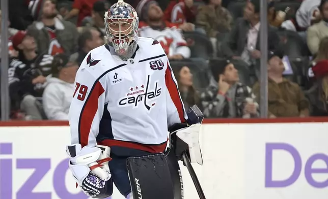 Washington Capitals' Charlie Lindgren stands on the ice during the second period of an NHL hockey game against the New Jersey Devils Saturday, Nov. 30, 2024, in Newark, N.J. (AP Photo/Pamela Smith)