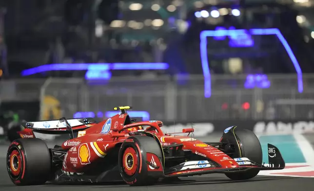 Ferrari driver Carlos Sainz of Spain in action during the qualifying for the Formula One Abu Dhabi Grand Prix at the Yas Marina Circuit in Abu Dhabi, UAE, Saturday, Dec. 7, 2024. (AP Photo/Darko Bandic)