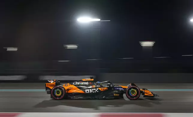 McLaren driver Oscar Piastri of Australia in action during the qualifying for the Formula One Abu Dhabi Grand Prix at the Yas Marina Circuit in Abu Dhabi, UAE, Saturday, Dec. 7, 2024. (AP Photo/Altaf Qadri)