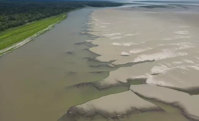 FILE - Signs of drought are visible on the Amazon River, near Santa Sofia, Colombia, Oct. 20, 2024. (AP Photo/Ivan Valencia, File)