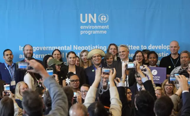 FILE - Juliet Kabera, third from right, director general of the Rwanda Environment Management Authority, Anthony Agotha, special envoy for Climate and Environment Diplomacy, European Union, Panama's Juan Carlos Monterrey, Olga Givernet, French Delegate Minister for Energy and Mexico's Camila Zepeda pose after a news conference at the fifth session of the Intergovernmental Negotiating Committee on Plastic Pollution in Busan, South Korea, Dec. 1, 2024. (AP Photo/Ahn Young-joon)