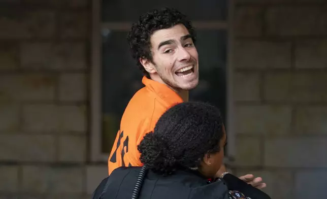 Suspect Luigi Mangione is taken into the Blair County Courthouse on Tuesday, Dec. 10, 2024, in Hollidaysburg, Pa. (Benjamin B. Braun/Pittsburgh Post-Gazette via AP)