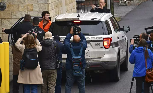 Suspect Luigi Mangione is taken into the Blair County Courthouse on Tuesday, Dec. 10, 2024, in Hollidaysburg, Pa. (Janet Klingbeil via AP)