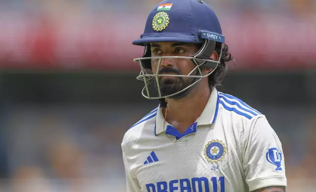 India's KL Rahul walks off the field after losing his wicket during play on day four of the third cricket test between India and Australia at the Gabba in Brisbane, Australia, Tuesday, Dec. 17, 2024. (AP Photo/Pat Hoelscher)