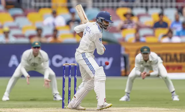 India's Ravindra Jadeja bats during play on day four of the third cricket test between India and Australia at the Gabba in Brisbane, Australia, Tuesday, Dec. 17, 2024. (AP Photo/Pat Hoelscher)