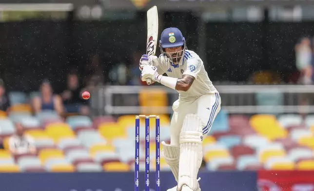 India's KL Rahul bats during play on day four of the third cricket test between India and Australia at the Gabba in Brisbane, Australia, Tuesday, Dec. 17, 2024. (AP Photo/Pat Hoelscher)