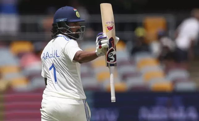 India's KL Rahul reacts on reaching 50 runs during play on day four of the third cricket test between India and Australia at the Gabba in Brisbane, Australia, Tuesday, Dec. 17, 2024. (AP Photo/Pat Hoelscher)