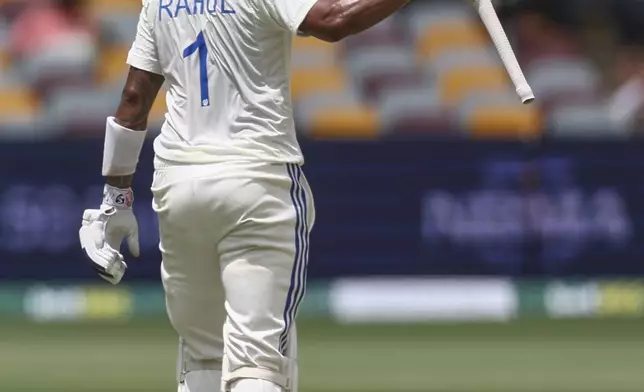 India's KL Rahul reacts on reaching 50 runs during play on day four of the third cricket test between India and Australia at the Gabba in Brisbane, Australia, Tuesday, Dec. 17, 2024. (AP Photo/Pat Hoelscher)