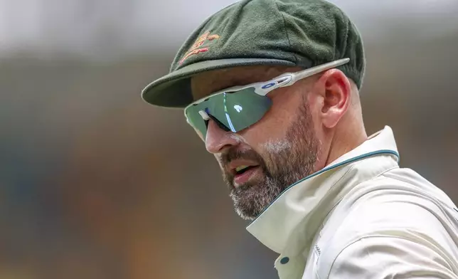 Australia's Nathan Lyon looks on during play on day four of the third cricket test between India and Australia at the Gabba in Brisbane, Australia, Tuesday, Dec. 17, 2024. (AP Photo/Pat Hoelscher)