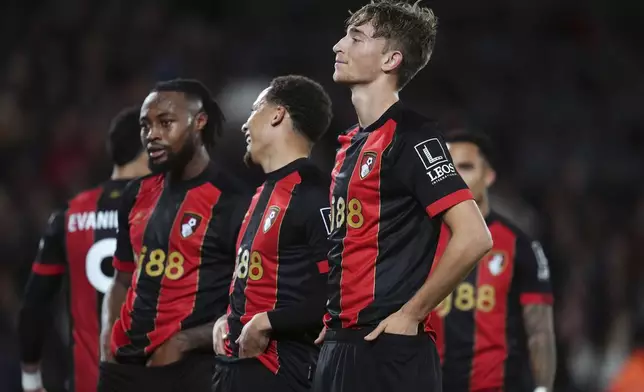 Bournemouth's Dean Huijsen, front, celebrates scoring the opening goal during the English Premier League soccer match between AFC Bournemouth and Tottenham Hotspur in Bournemouth, England, Thursday, Dec. 5, 2024. (Adam Davy/PA via AP)