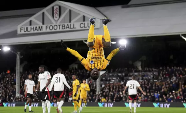 Brighton and Hove Albion's Carlos Baleba celebrates scoring his sides first goal during the English Premier League soccer match between FC Fulham and Brighton &amp; Hove Albion in London, England, Thursday, Dec. 5, 2024. ( John Walton/PA via AP)