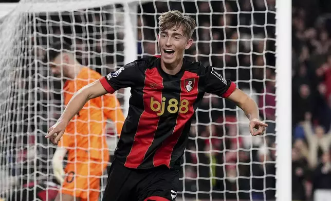 Bournemouth's Dean Huijsen celebrates scoring the opening goal during the English Premier League soccer match between AFC Bournemouth and Tottenham Hotspur in Bournemouth, England, Thursday, Dec. 5, 2024. (Adam Davy/PA via AP)