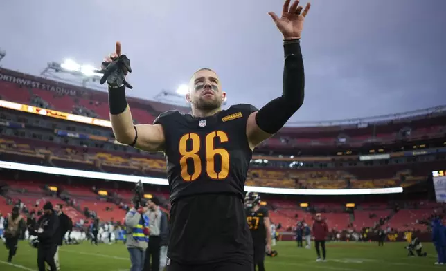 Washington Commanders tight end Zach Ertz (86) celebrates the team's 42-19 win against the Tennessee Titans in an NFL football game Sunday, Dec. 1, 2024, in Landover, Md. (AP Photo/Matt Slocum)