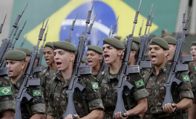 FILE - Armed forces take part in a ceremony to commemorate the 1964 military coup that began the last Brazilian dictatorship, in Sao Paulo, Brazil, March 28, 2019. (AP Photo/Andre Penner, File)