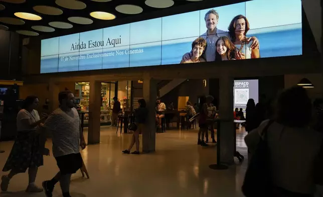 People wait to watch the film "I'm Still Here," at a movie theater in Sao Paulo, Friday, Dec. 20, 2024. (AP Photo/Andre Penner)