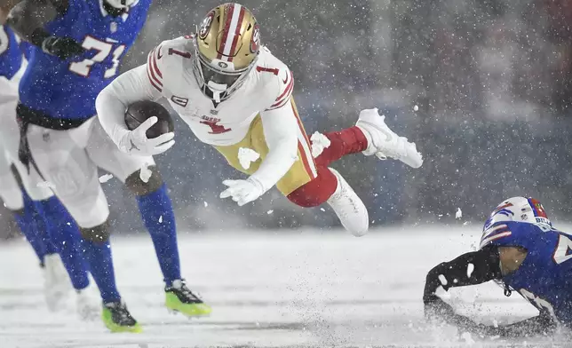 San Francisco 49ers wide receiver Deebo Samuel Sr. (1) dives forward during the first half of an NFL football game against the Buffalo Bills in Orchard Park, N.Y., Sunday, Dec. 1, 2024. (AP Photo/Adrian Kraus)