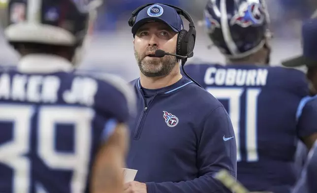 Tennessee Titans head coach Brian Callahan looks up from the sideline during the first half of an NFL football game against the Indianapolis Colts, Sunday, Dec. 22, 2024, in Indianapolis. (AP Photo/Michael Conroy)