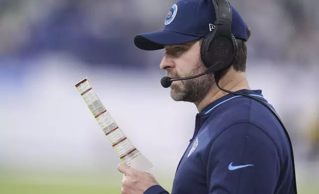 Tennessee Titans head coach Brian Callahan looks onto the field during the second half of an NFL football game against the Indianapolis Colts, Sunday, Dec. 22, 2024, in Indianapolis. (AP Photo/Michael Conroy)