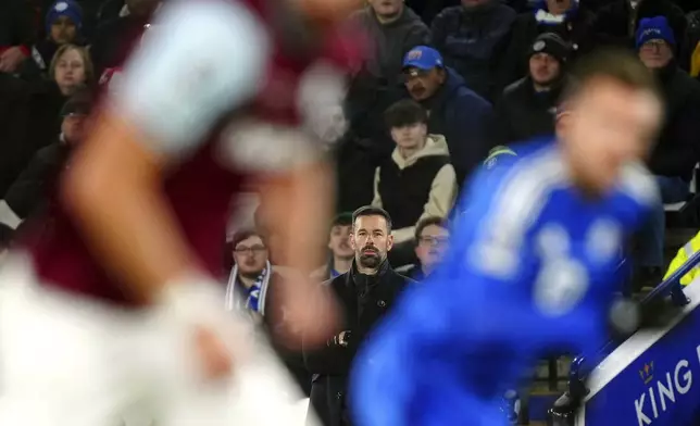 Leicester City manager Ruud van Nistelrooy watches during the Premier League soccer match against West Ham United at the King Power Stadium, Tuesday Dec. 3, 2024, Leicester, England. (Mike Egerton/PA via AP)