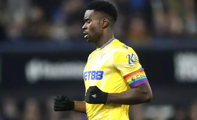 Crystal Palace's Marc Guehi wears the Rainbow Laces captain's armband which has the words 'Jesus Heart You' on during the England Premier League soccer match between Ipswich Town and Crystal Palace at Portman Road, Ipswich, England, Tuesday, Dec. 3, 2024. (Zac Goodwin/PA via AP)