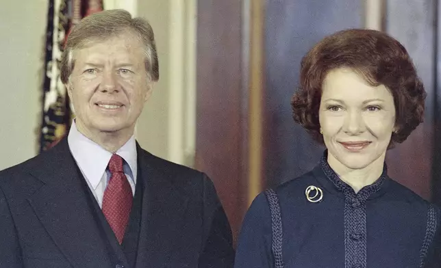 FILE - President-elect Jimmy Carter, left, with his wife Rosalynn Carter on Dec. 3, 1976. (AP Photo/Charles Harrity, File)