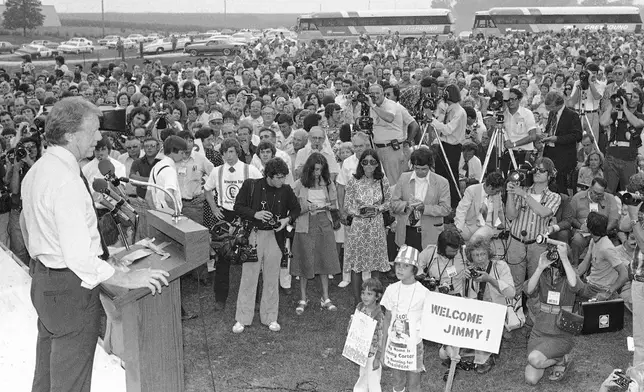 FILE - Jimmy Carter speaks to a crowd of supporters during his presidential campaign on the Van Ryswyk farm in Des Moines, Iowa, Aug. 24, 1976. (AP Photo, File)