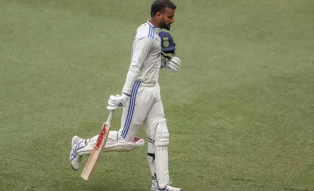 India's Akash Deep walks off the field after losing his wicket during play on day five of the third cricket test between India and Australia at the Gabba in Brisbane, Australia, Wednesday, Dec. 18, 2024. (AP Photo/Pat Hoelscher)