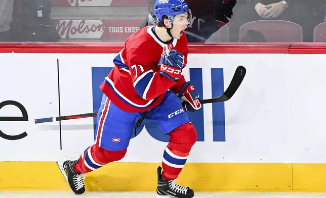 Montreal Canadiens' Jake Evans reacts after scoring against the Detroit Red Wings during first-period NHL hockey game action in Montreal, Saturday, Dec. 21, 2024. (Graham Hughes/The Canadian Press via AP)