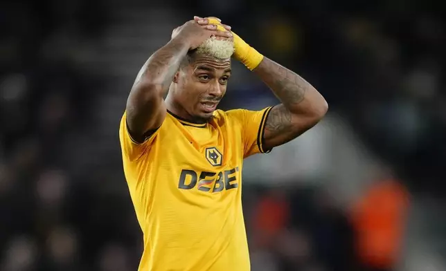 Wolverhampton Wanderers' Mario Lemina reacts to a misplaced pass, during the English Premier League soccer match between Wolverhampton Wanderers and Ipswich Town, at Molineux Stadium, in Wolverhampton, Saturday, Dec. 14, 2024. (Nick Potts/PA via AP)